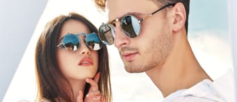 Man and woman wearing sunglasses